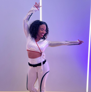 Dr. Chelsea Jackson Roberts poses in white during All For One