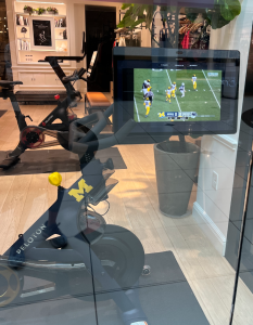 A Michigan-branded Peloton bike showing the game in-store