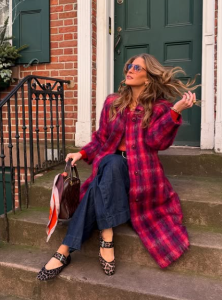 Rebecca Kennedy sitting on a stoop, 2025 Peloton Instructor Superlatives Best Hair