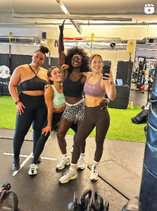 Tunde, Emma, Katie and Ash in a gym