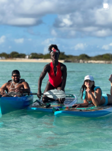 Tunde, Rad and Katie in the water on vacation