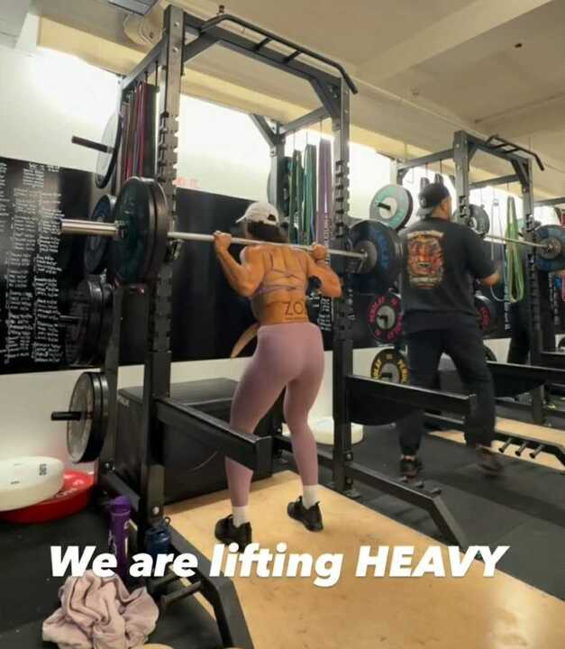 Peloton instructor podcast appearances woman lifting heavy weights