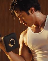 heated rivalry star hudson williams with dumbbell for peloton let yourself go ad