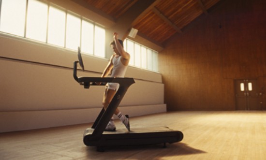 heated rivalry start Hudson Williams on a Tread+ for the Peloton let yourself go campaign