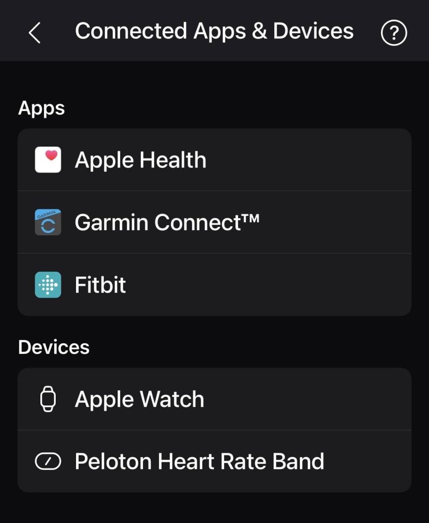 Peloton Connected Apps and Devices screen listing Apple Health Garmin Connect and Fitbit under Apps and Apple Watch and Peloton Heart Rate Band under Devices