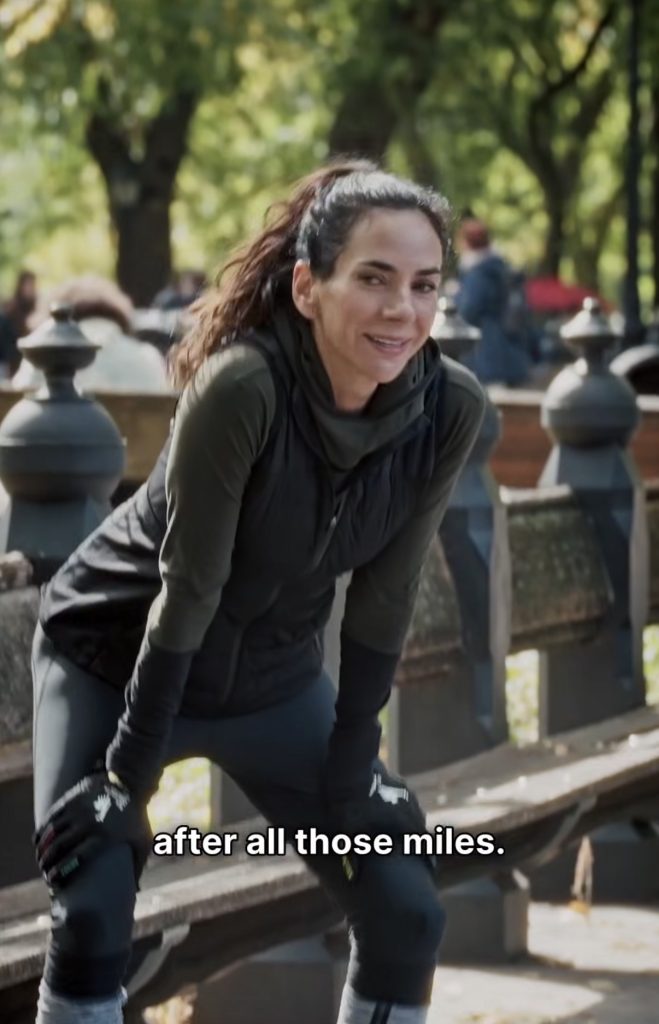 Mariana Fernandez catching her breath after a run outdoors, representing her 30-plus years of running and racing