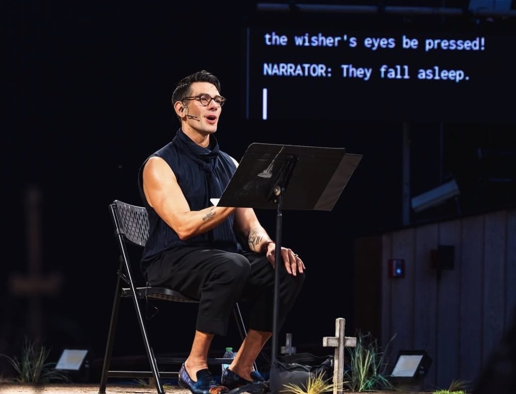 Peloton instructor Matty Maggiacomo reads onstage during Shakespeare in the Park at the Delacorte Theater