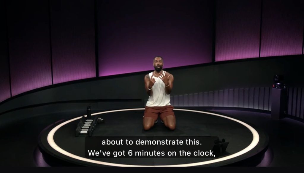 Jermaine Johnson Glutes & Legs Strength class, instructor demonstrating before a timed round