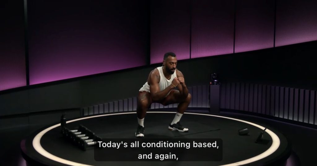 Jermaine Johnson Glutes & Legs Strength class, squat hold during conditioning segment