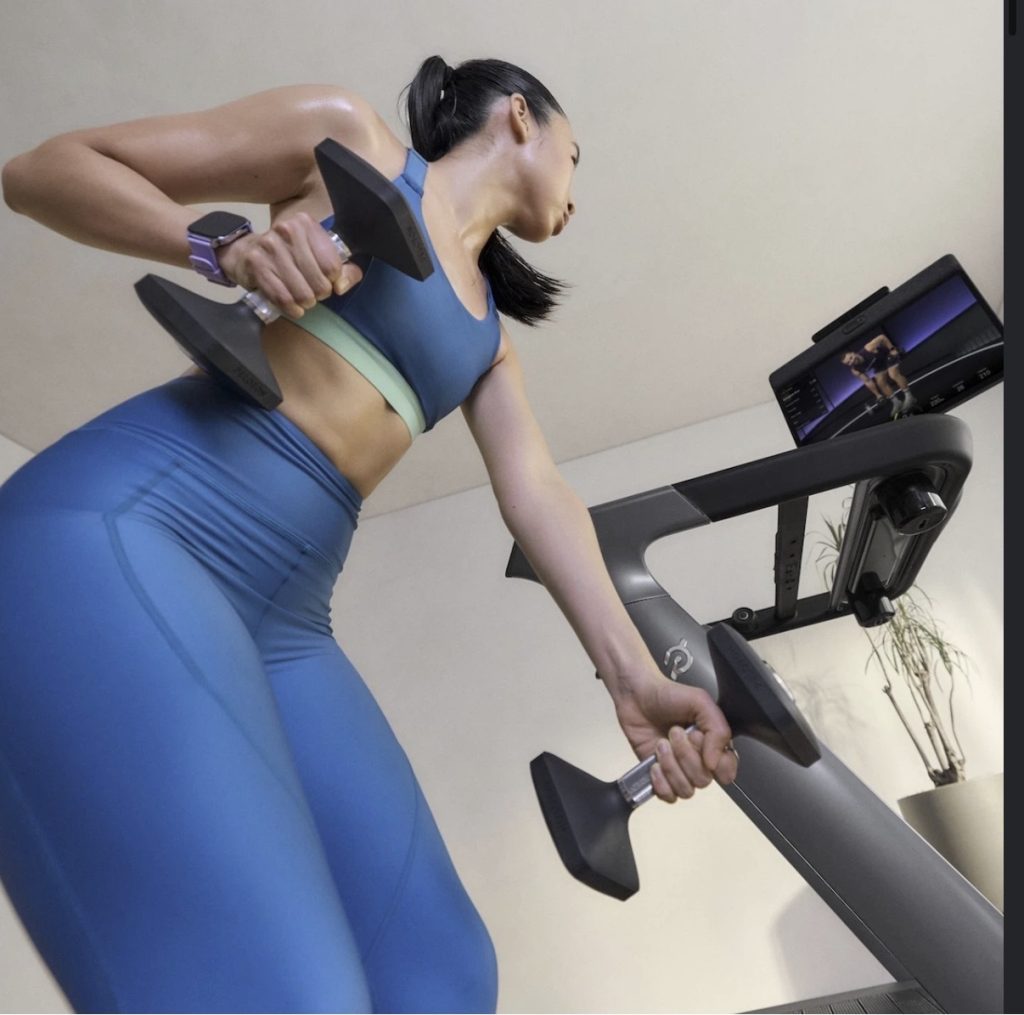 Peloton wearables strategy in action as a member wears an Apple Watch during a Tread strength workou