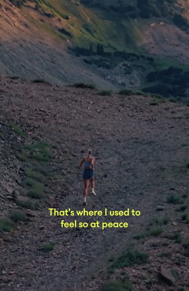 Becs Gentry CCC decision moment shown on a wildflower trail in HOKA video
