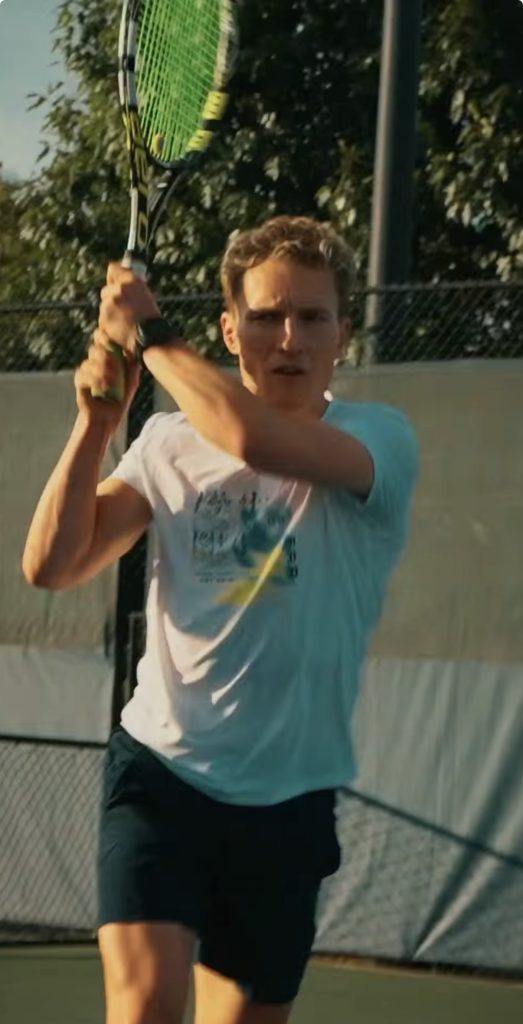 Train for Tennis program instructor Matt Wilpers lines up a backhand on the court