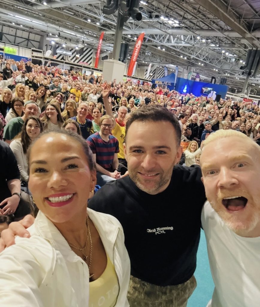 National Running Show selfie with Susie Chan and co-hosts in front of a packed Birmingham crowd