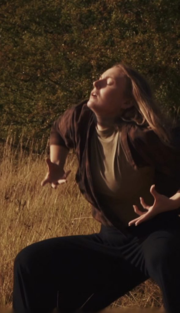 Jessie Malone in a field during the music video shoot for her new song