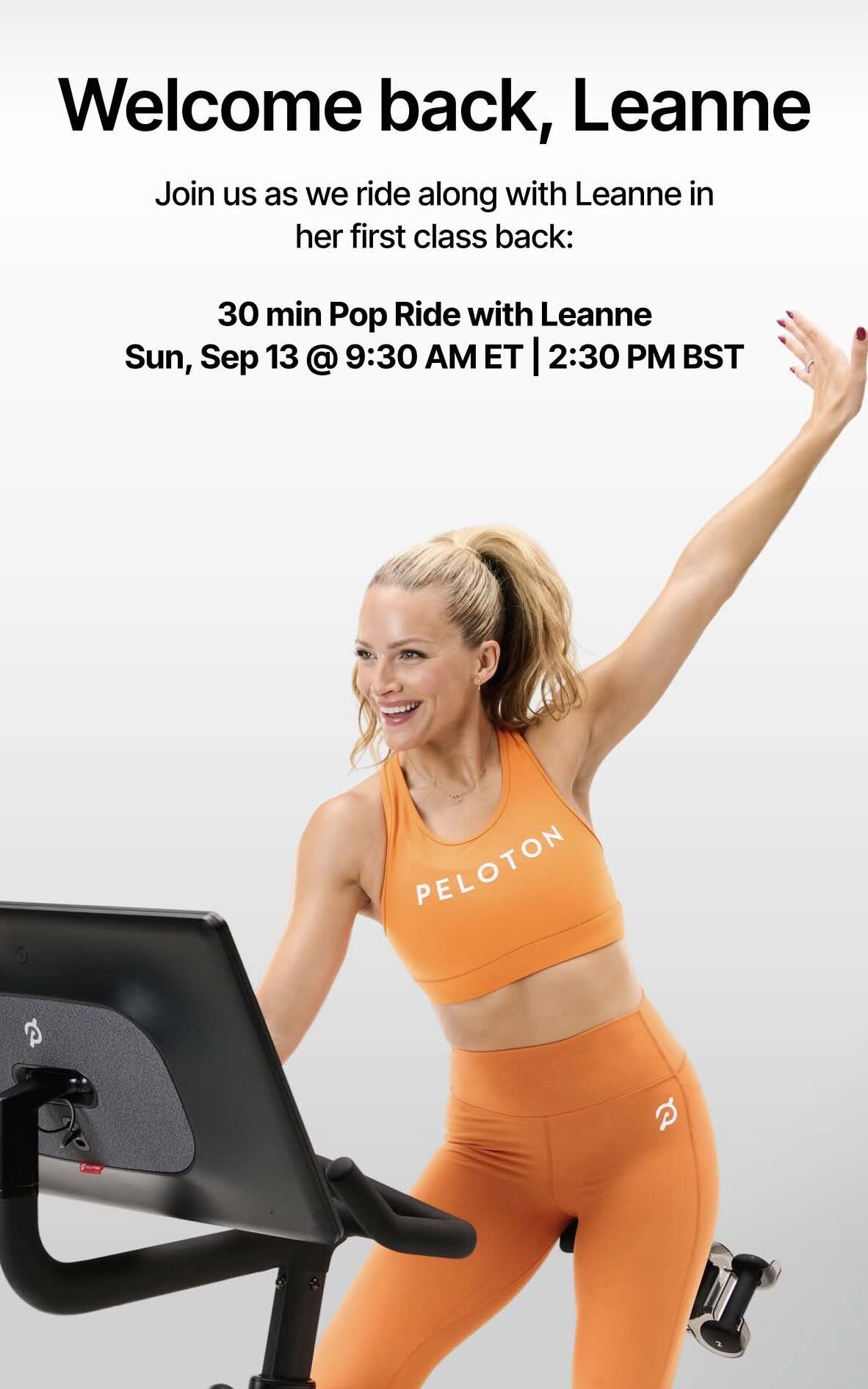 Leanne Hainsby-Alldis smiling and waving before her Peloton first class back, a Pop Ride announced for September 13