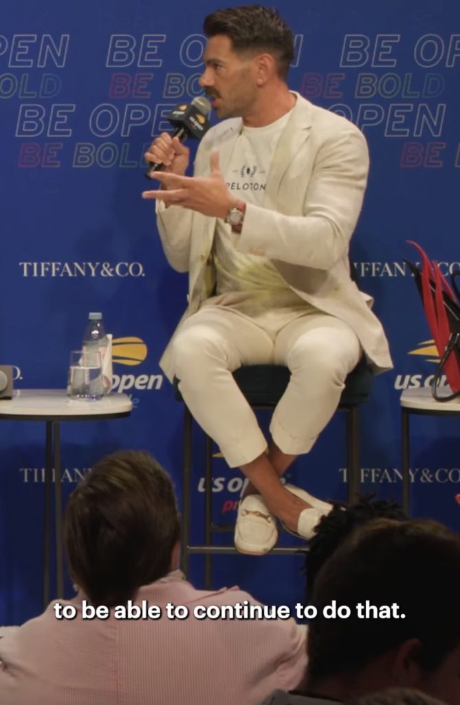 US Open Pride panel moment as Matty Maggiacomo speaks into a microphone.