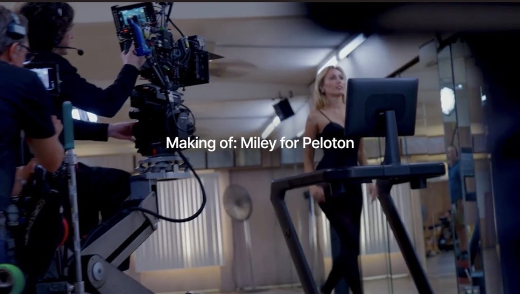 Miley Cyrus Peloton ad crew filming Miley on the Peloton Tread with a camera crane