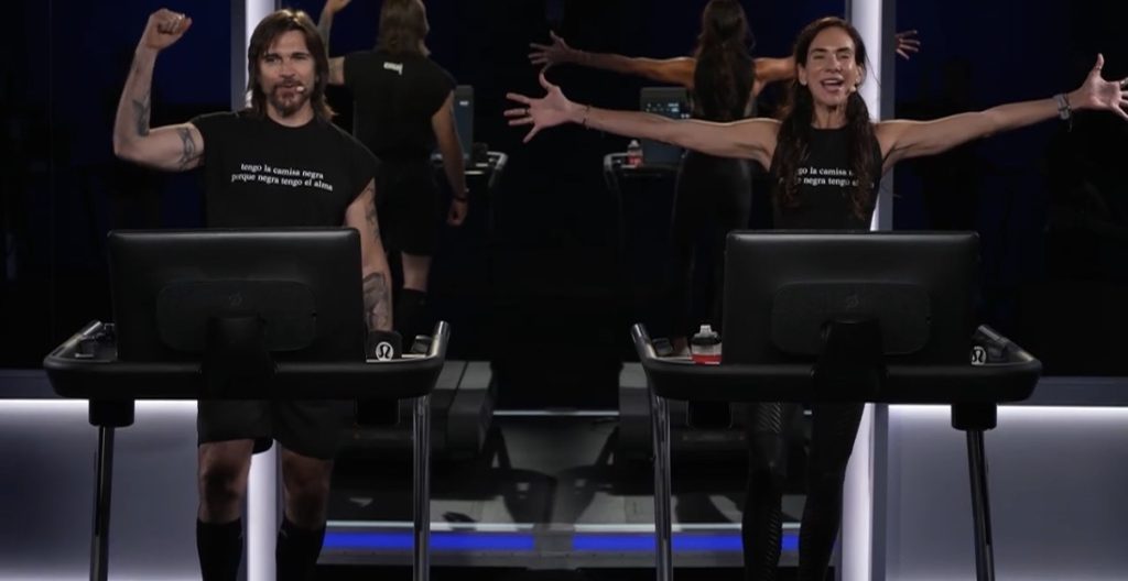 Juanes Walk with Juanes and Mariana Fernández raising their arms on Peloton Treads