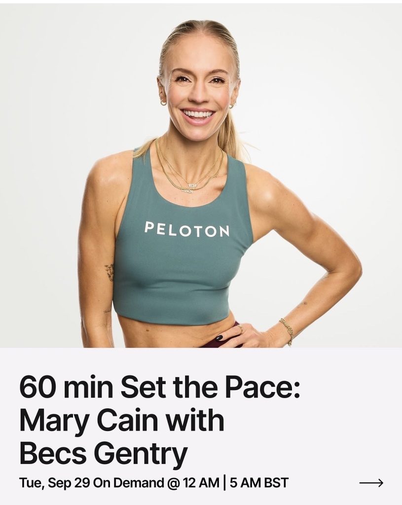 Atalanta NYC Set the Pace class instructor Becs Gentry smiling in a teal Peloton sports top