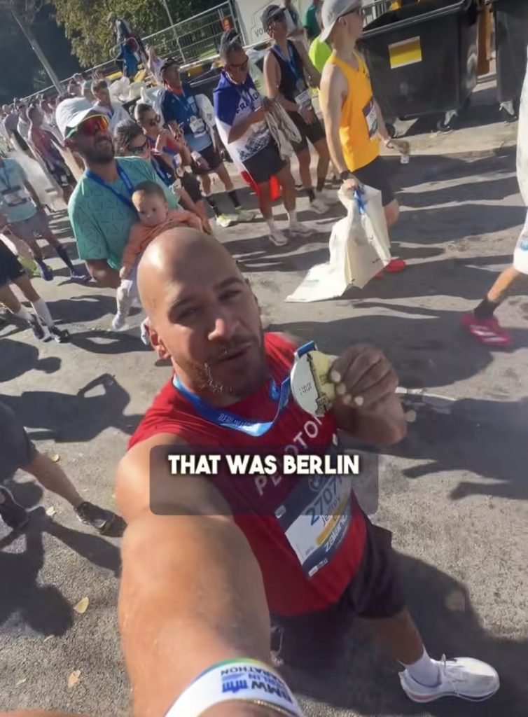 Peloton instructor races: Jeffrey McEachern holds his BMW Berlin Marathon medal after finishing