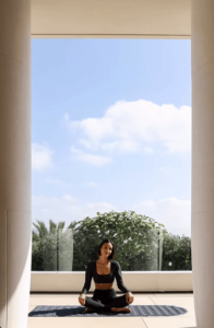 Aditi Shah posing at Dior on a yoga mate
