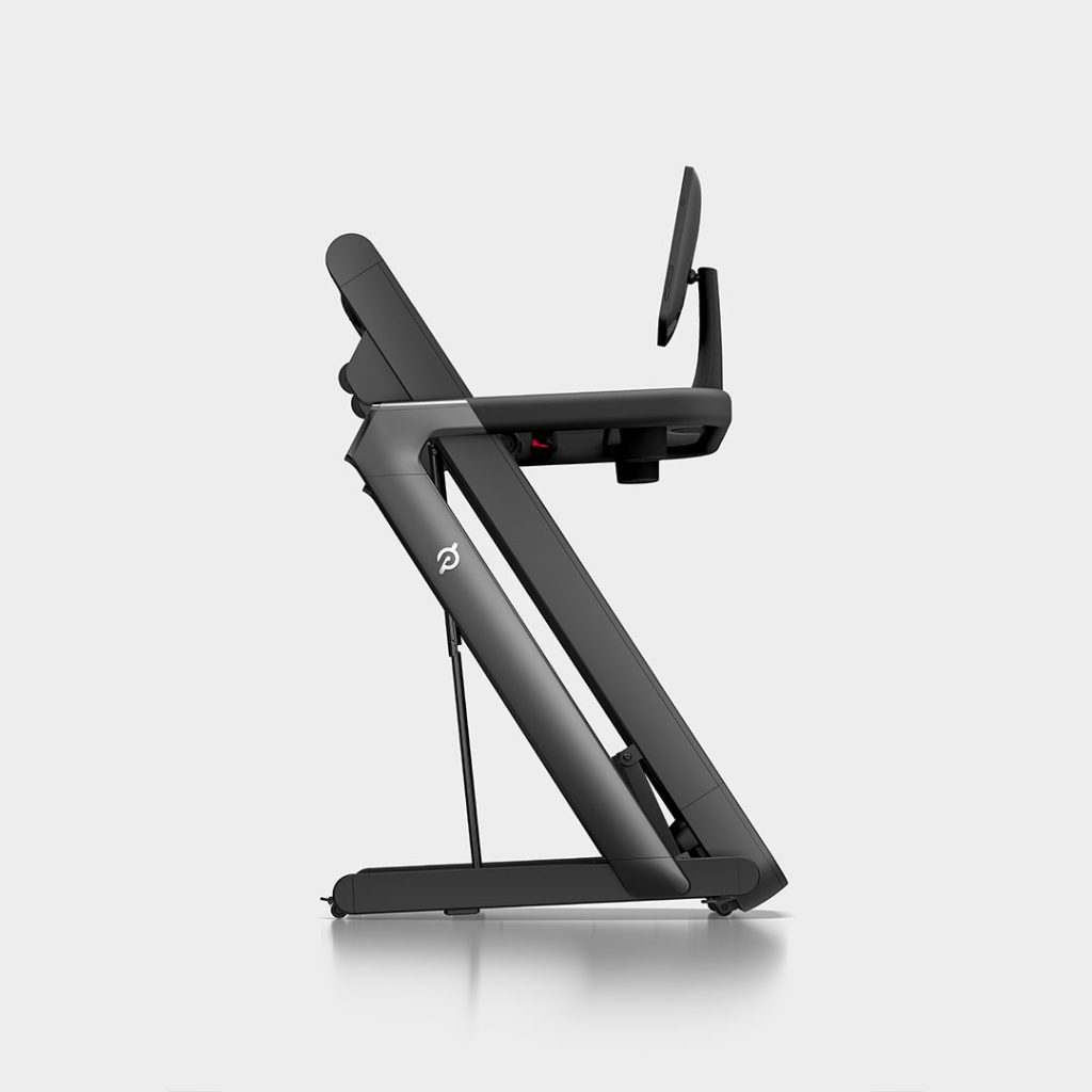 Peloton Tread Flex folding treadmill in its folded position, shown from the side with the screen angled