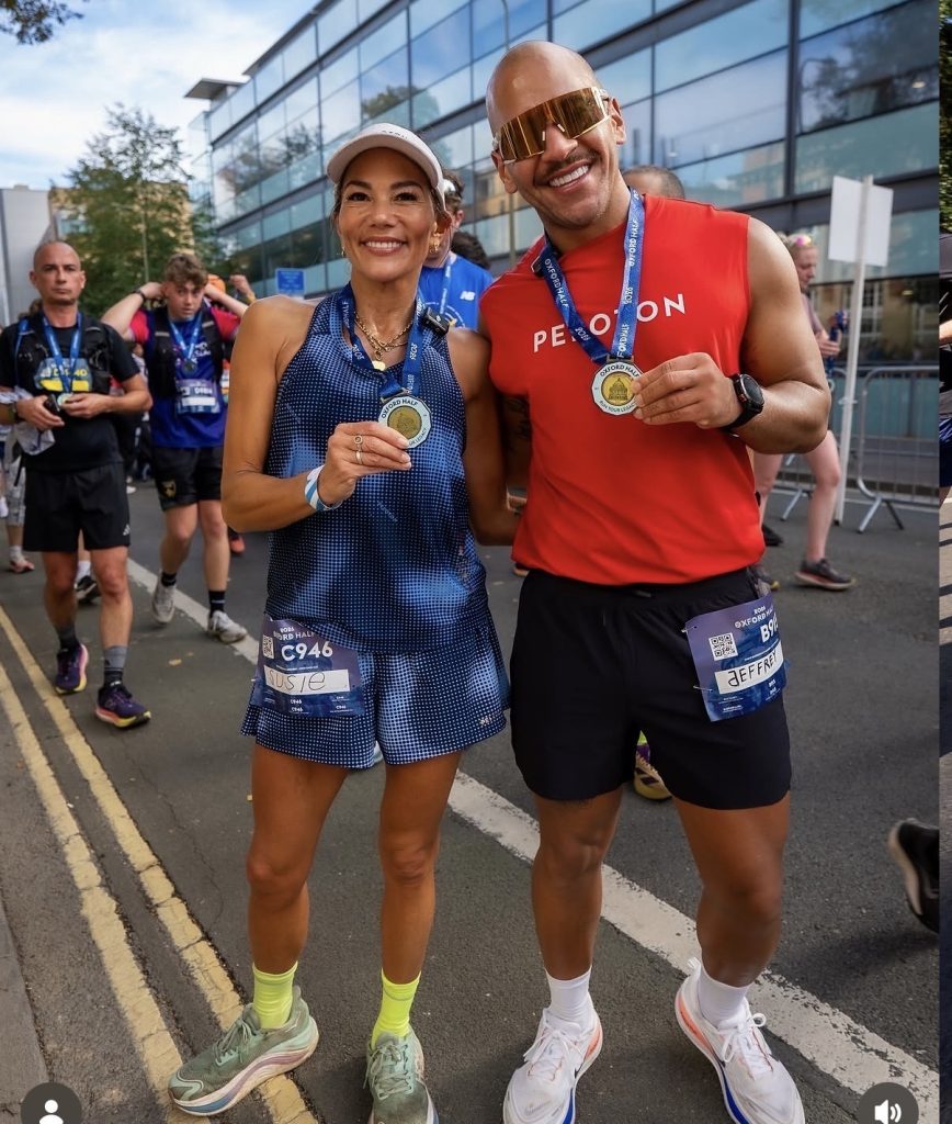 Peloton instructors race weekend Susie Chan and Jeffrey McEachern holding their Oxford Half medals