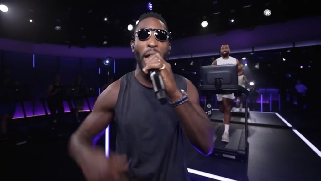 Tinie Tempah Peloton class with Tinie singing as Jermaine Johnson runs on the Tread at Peloton Studios London