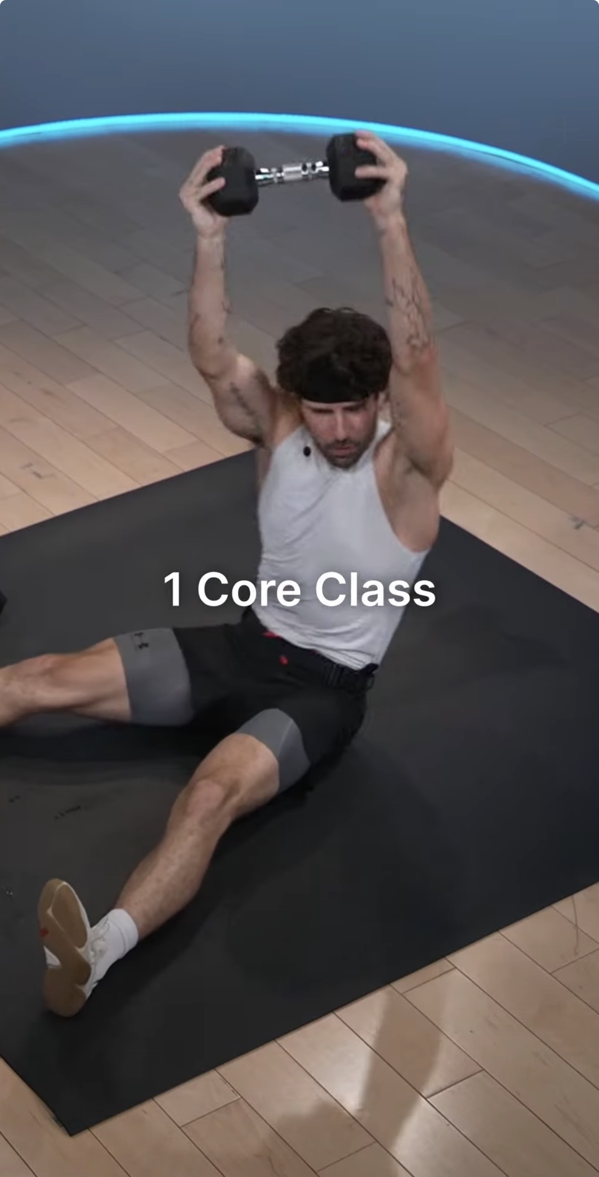 Countdown to Turkey Burn 2026 Core class with an overhead dumbbell reac