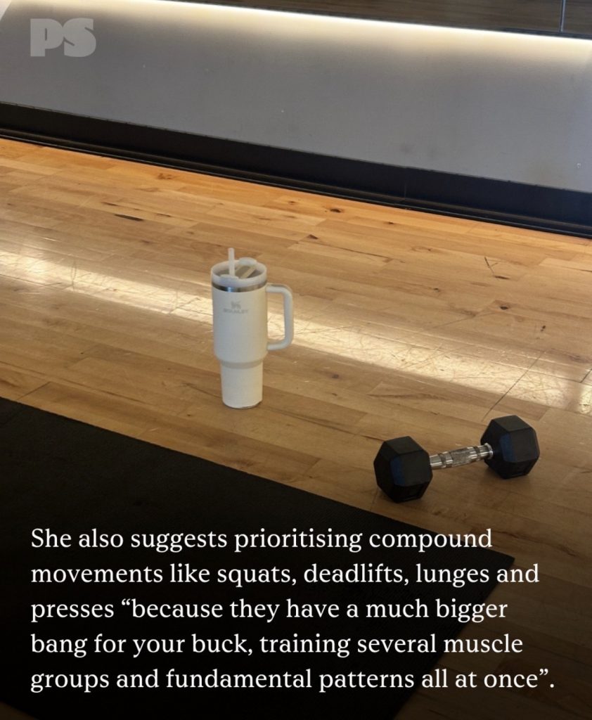 Efficient workout setup with a single dumbbell, exercise mat, and water tumbler