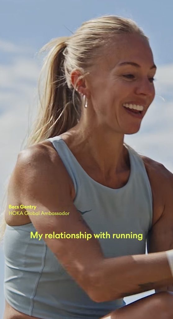 Becs Gentry Hoka global ambassador smiling in a Hoka video about her relationship with running