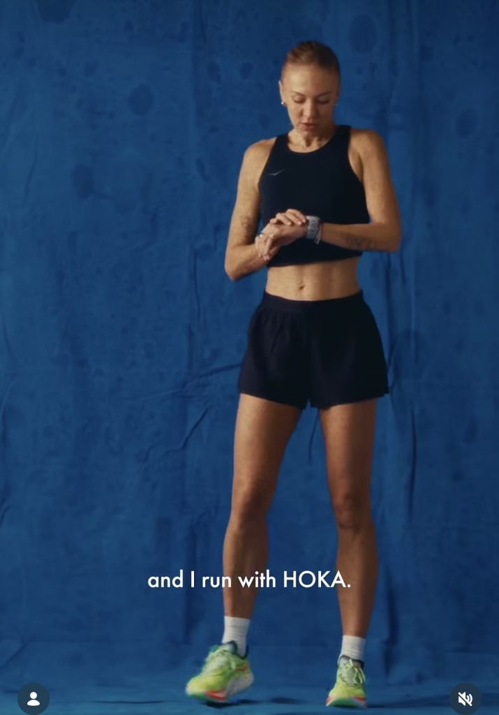 Becs Gentry Hoka global ambassador announcement video with the HOKA logo on a blue backdrop
