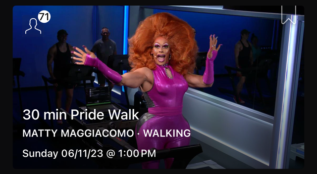 Matty Maggiacomo Broadway drag persona Mara Thonner in hot pink latex leading a 30 min Pride Walk on the Peloton Tread