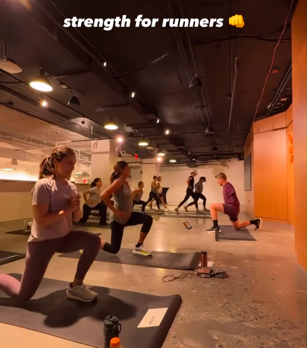 Participants doing single leg stability work during the Strength for Runners class